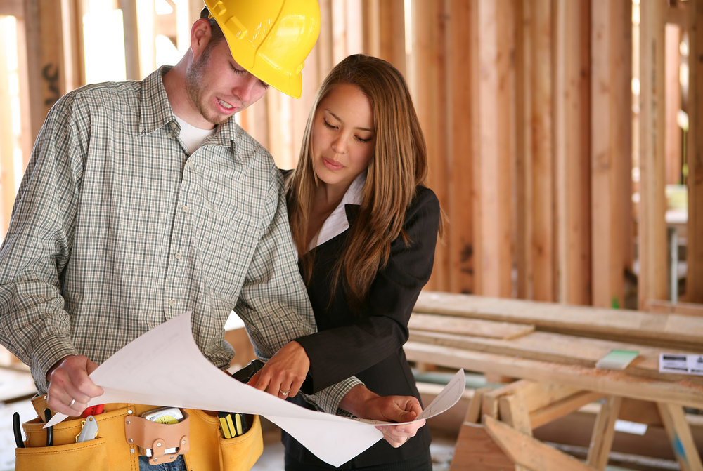 home construction plan review with contractor and client